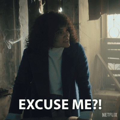A Woman With Curly Hair Says Excuse Me On A Netflix Ad GIF