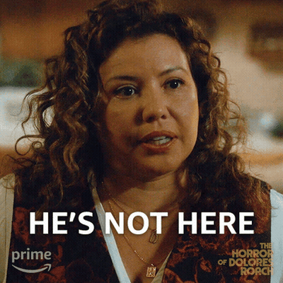 A Woman With Curly Hair Says He 'S Not Here On A Poster For The Horror Of Dolores Roach GIF