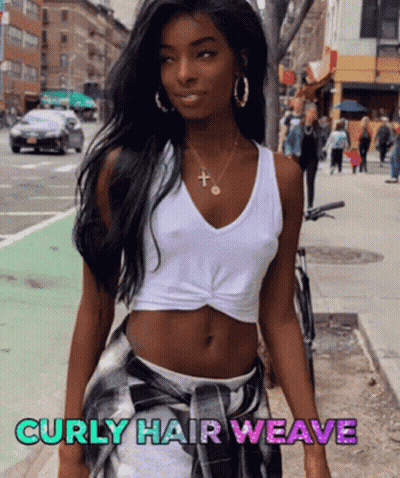 A Woman With Curly Hair Wearing A White Tank Top And Plaid Skirt GIF