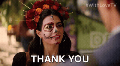 A Woman With Day Of The Dead Makeup On Her Face Is Saying Thank You GIF