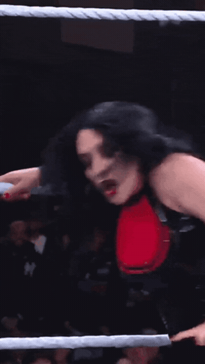 A Woman With Devil Horns On Her Head Is In A Ring GIF