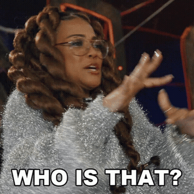 A Woman With Dreadlocks And Glasses Says " Who Is That " GIF