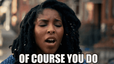 A Woman With Dreadlocks Is Making A Face And Says Of Course You Do GIF