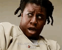 A Woman With Dreadlocks Is Making A Funny Face And Says `` Well Ain T Dat Boutta Pause '' . GIF