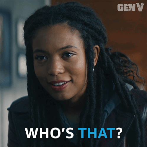 A Woman With Dreadlocks Is Smiling And Asking Who 'S That GIF