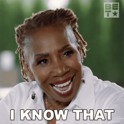 A Woman With Dreadlocks Is Smiling And Says I Know That GIF