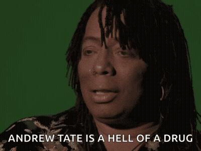 A Woman With Dreadlocks Is Talking About Andrew Tate GIF