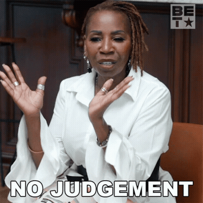 A Woman With Dreadlocks Says No Judgement With Her Hands Up GIF