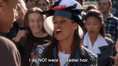 A Woman With Dreadlocks Wearing A Graduation Cap And Gown Says I Do Not Wear Polyester Hair . GIF
