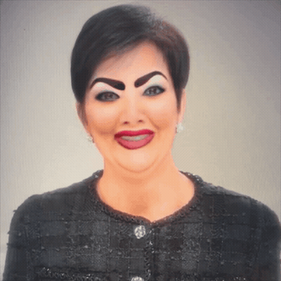 A Woman With Fake Eyebrows And Red Lips Is Wearing A Black Shirt GIF