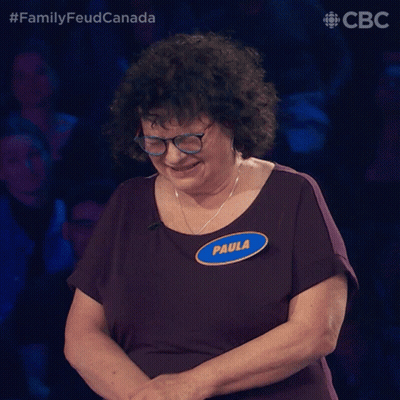 A Woman With Glasses And A Name Tag That Says Paula On It GIF
