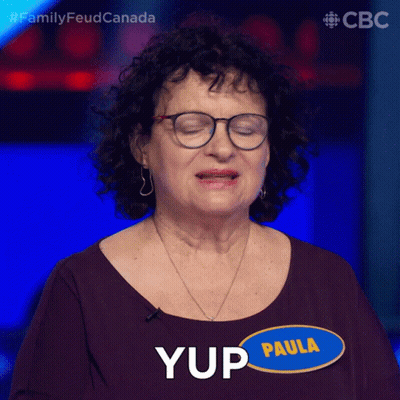 A Woman With Glasses And A Name Tag That Says Paula On It GIF