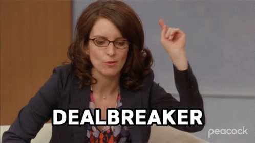 A Woman With Glasses And A Peacock Logo On The Bottom Right GIF