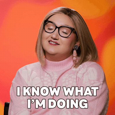 A Woman With Glasses And A Pink Sweater Says " I Know What I 'M Doing " GIF