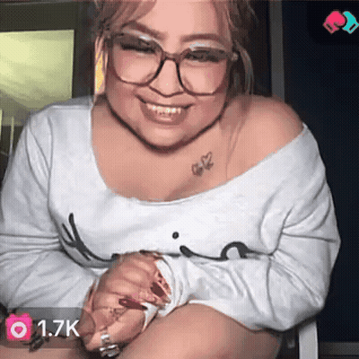 A Woman With Glasses And A Tattoo On Her Shoulder Has 1.7K Followers On Her Account GIF