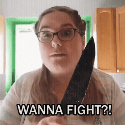 A Woman With Glasses Is Holding A Knife And Saying Wanna Fight GIF