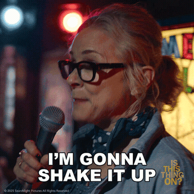 A Woman With Glasses Is Holding A Microphone And Saying I 'M Gonna Shake It Up GIF