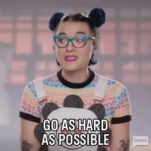 A Woman With Glasses Is Holding A Stuffed Panda Bear And Says Go As Hard As Possible GIF