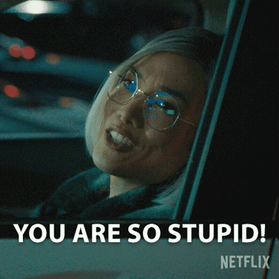 A Woman With Glasses Is Sitting In A Car And Says You Are So Stupid GIF