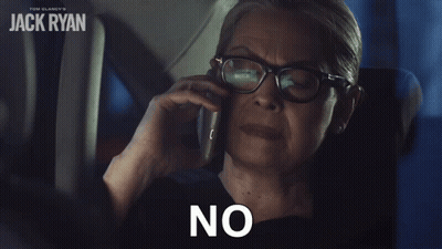 A Woman With Glasses Is Talking On A Cell Phone And The Word No Is On The Screen GIF