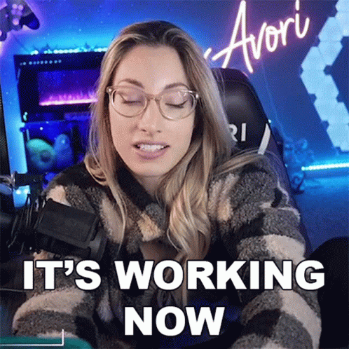 A Woman With Glasses Says It 'S Working Now While Sitting In Front Of A Computer GIF