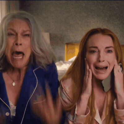 A Woman With Gray Hair And A Woman With Red Hair Screaming GIF