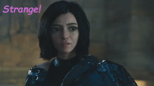 A Woman With Green Hair Is Standing In Front Of A Sign That Says " Strange " GIF