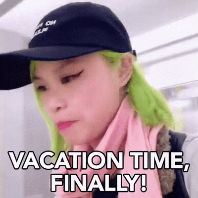 A Woman With Green Hair Is Wearing A Hat And A Scarf And Says `` Vacation Time , Finally ! '' GIF