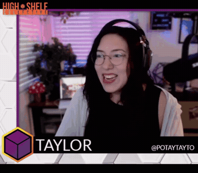 A Woman With Headphones And The Name Taylor On The Bottom GIF