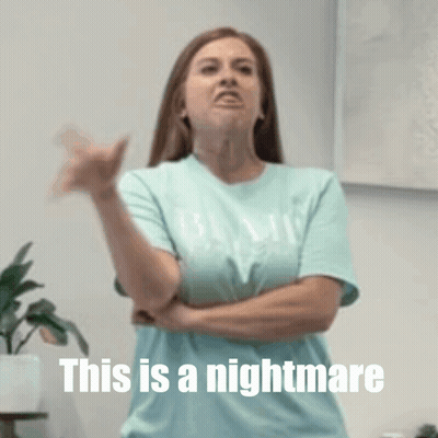 A Woman With Her Arms Crossed And The Words This Is A Nightmare Above Her GIF