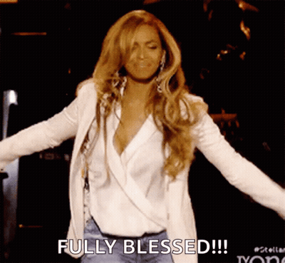 A Woman With Her Arms Outstretched And The Words Fully Blessed Written On The Bottom GIF