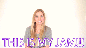 A Woman With Her Arms Outstretched And The Words " This Is My Jam " On The Bottom GIF