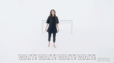 A Woman With Her Arms Outstretched Says Wait Wait Wait Wait Netflix GIF