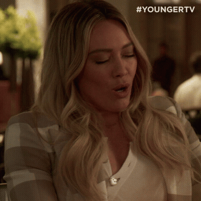 A Woman With Her Eyes Closed And The Hashtag Youngertv GIF