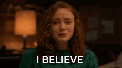 A Woman With Her Eyes Closed And The Word I Believe Above Her Head GIF