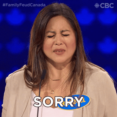 A Woman With Her Eyes Closed And The Word Sorry On Her Chest GIF