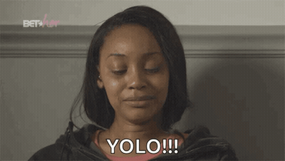 A Woman With Her Eyes Closed And The Word Yolo Written On Her Face GIF