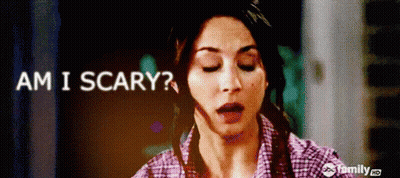 A Woman With Her Eyes Closed And The Words Am I Scary GIF