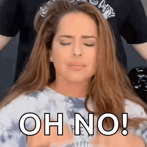A Woman With Her Eyes Closed And The Words Oh No On Her Chest GIF