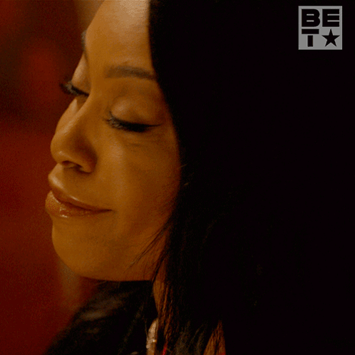 A Woman With Her Eyes Closed And The Words That 'S Right Below Her GIF