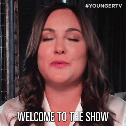 A Woman With Her Eyes Closed And The Words Welcome To The Show Below Her GIF