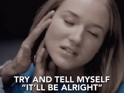 A Woman With Her Eyes Closed Is Being Touched By A Man . GIF