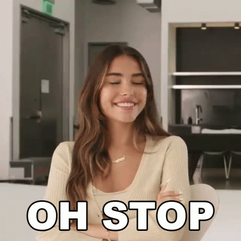 A Woman With Her Eyes Closed Is Smiling With The Words Oh Stop Above Her GIF