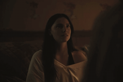 A Woman With Her Eyes Closed Looks At Another Woman GIF