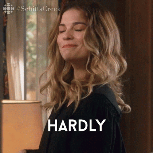 A Woman With Her Eyes Closed Says Hardly In Front Of Her GIF