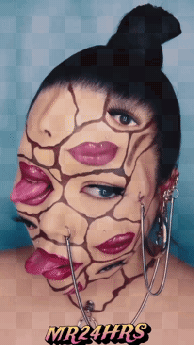 A Woman With Her Face Painted Has Mr24hrs Written On The Bottom Right GIF
