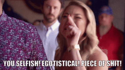 A Woman With Her Finger In Her Nose Says You Selfish Egotistical Piece Of Shit . GIF