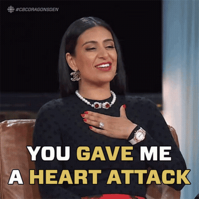 A Woman With Her Hand On Her Chest And The Words You Gave Me A Heart Attack Above Her GIF