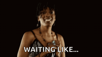 A Woman With Her Hands Folded And The Words Waiting Like Written On The Bottom GIF