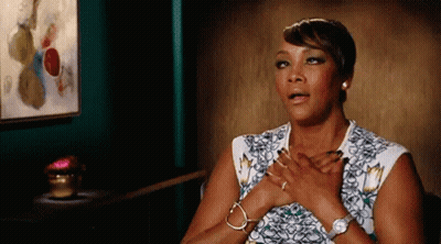 A Woman With Her Hands On Her Chest Is Wearing A Watch And Bracelets . GIF
